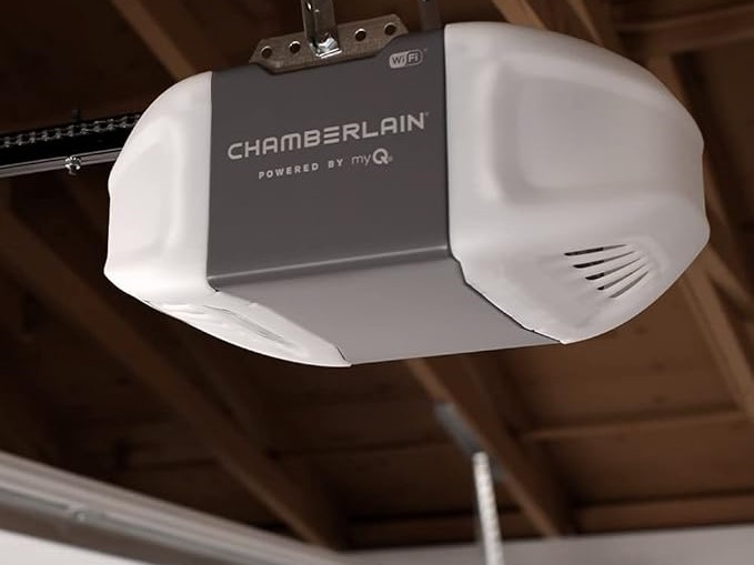 A modern garage door opener being mounted